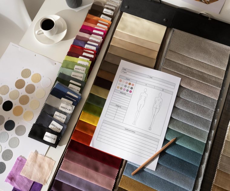 Material swatches and documentation in a fashion studio. 