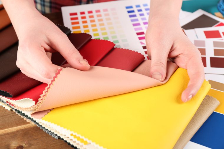 Designer working with fabric swatch samples. 