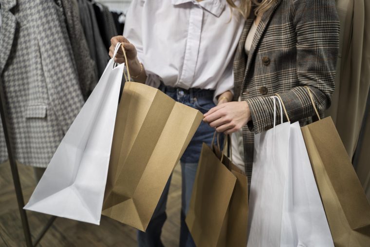 People holding shopping bags