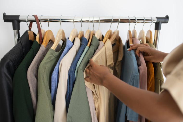 Person looking through clothes rack