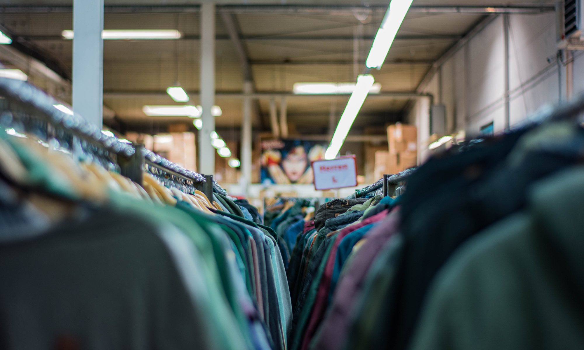 Clothing racks in fashion warehouse