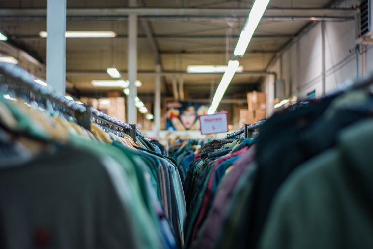 Clothing racks in fashion warehouse
