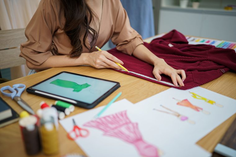 Fashion designer sketching new collection