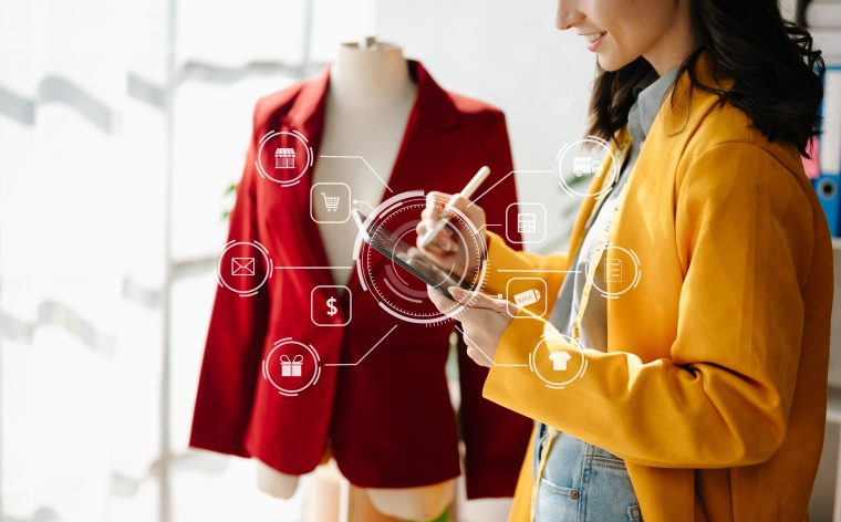 Woman using iPad in-fashion studio