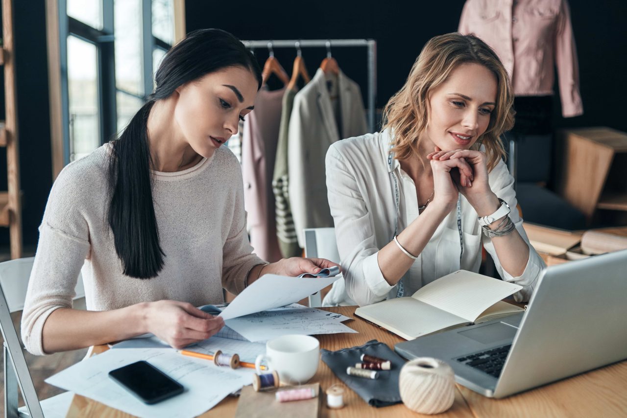 Two designers working together in a studio Two designers working together in a studio