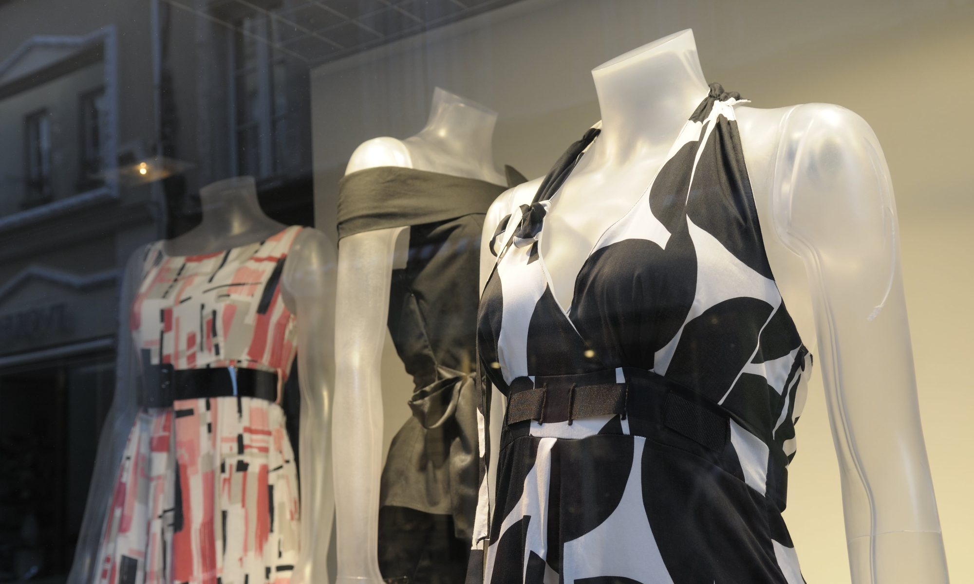 Clothes on mannequins in a shop window